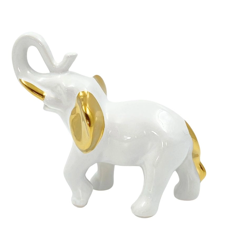 Feher porcelan elefant arany fulekkel, farokkal es agyarakkal, felfele allo ormannyal