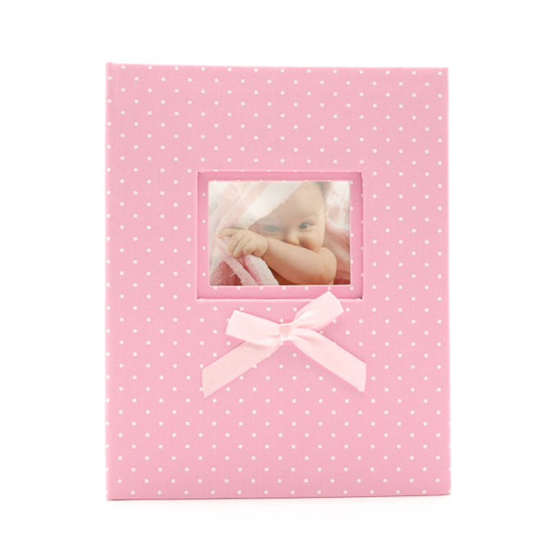 Közepes méretű, rózsaszín fehér pöttyös fotóalbum cserélhető képpel a borítóján, rózsaszín masnival