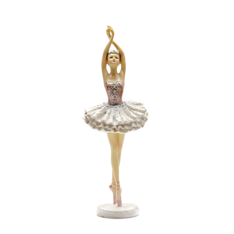 Lábújhegyen nyújtózkodó balerina, rózsaszín-ezüst tüll ruhában, fehér kerek csillogó talpazaton
